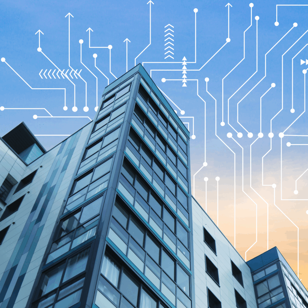 Composite image showing glass-fronted commercial building with a sunset sky in the background, with electrical grid overlay.